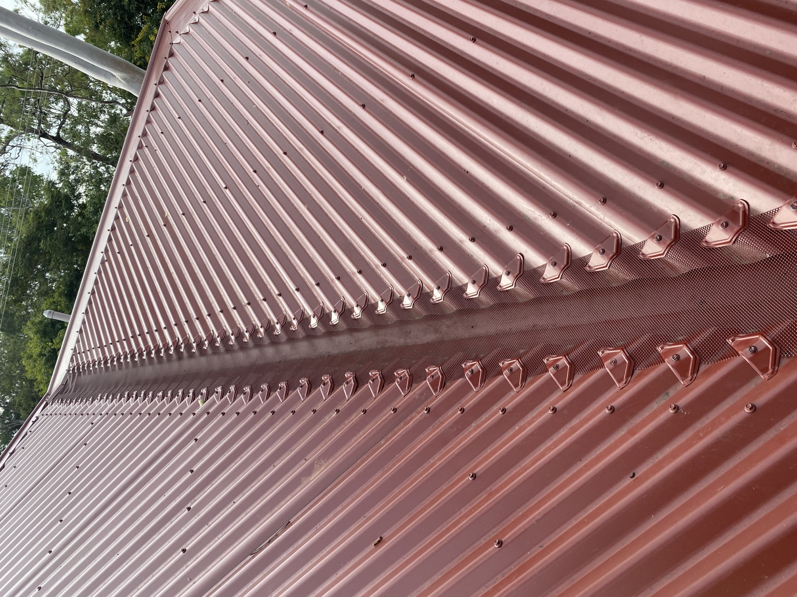 Fine metal mesh installed along a roof valley